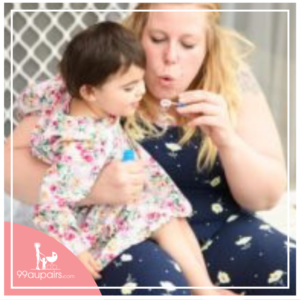 au pair playing with a little australian girl