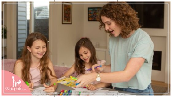 99aupairs Aupair doing crafting activities with her host family's children